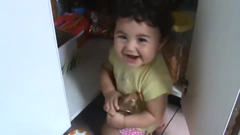 Funny baby hiding to eat snacks !