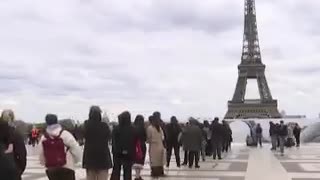 French artist JR unveiled Art installation visitors jumping "cliffs" below the Eiffel Tower in Paris