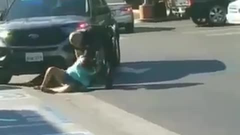 Blue jeep drives through crowd of protesters in Aurora