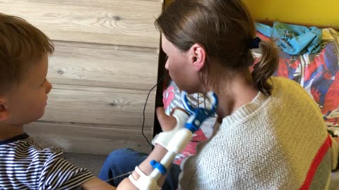 Kid pinches mum's nose with new 3D printed assistive device