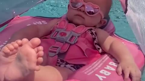 Baby enjoying the pool