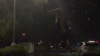 Landing a Backflip as the Lightning Strikes