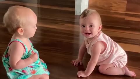 Little baby mia and her cousin mifa special baby time on floor huging and touching hands