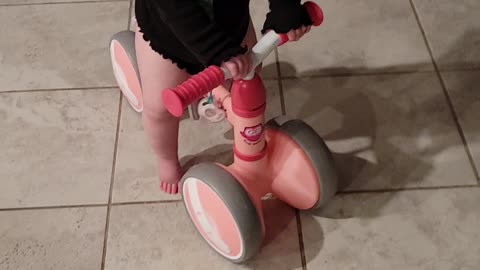 Baby riding her bike
