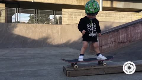 Little baby on skate. Skateboarding