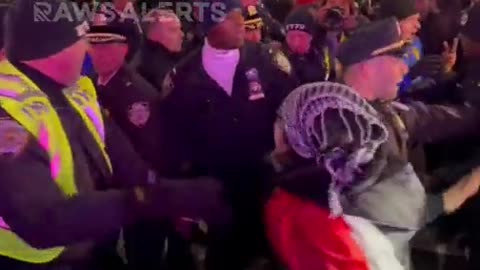 Protesters Disrupt the Rockefeller Christmas Tree Lighting breaking barricades and fighting police