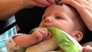 Balancing chocolate chips on babies head