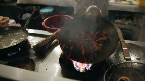 Cocking a crab on a wok