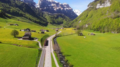 Drone Footage of a Train Traveling on a Valley