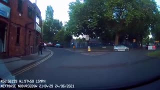 Two Cars Speed Past Car on Slow Street