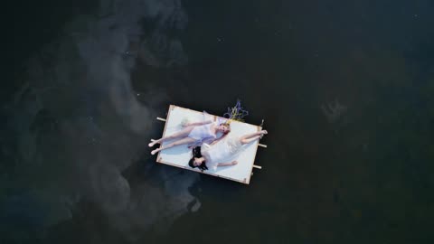 A Drone Footage of Women Lying Down on the Raft