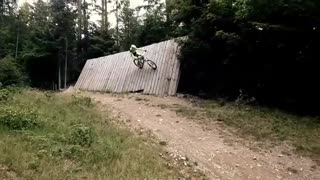 Biker yellow shirt wipeout wall ride