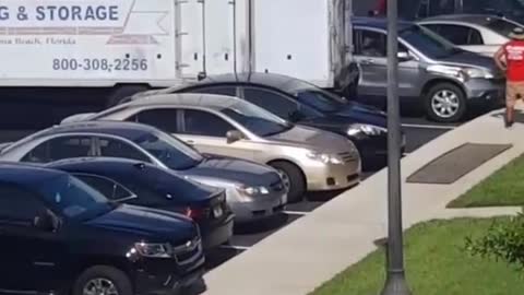 Moving Truck Destroys Parked Car