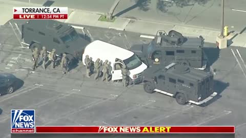 Law enforcement in Torrance, CA, has entered a white van believed to contain the suspect involved in the Lunar New Year shooting in Monterey Park