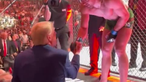 UFC fighter jumps over cage to greet Trump after TKO win