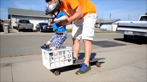 Brave toddler loves riding longboard