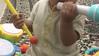 Baby playing with microphone