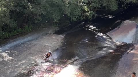 Woman Rides Down Waterfall and Hits People Sitting Below