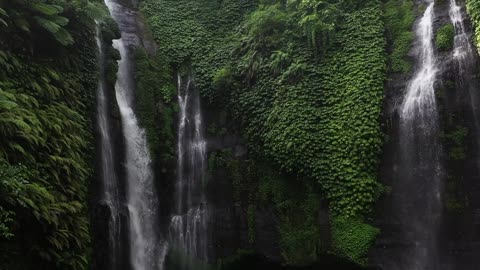 Beautiful Waterfall In The Jungle Falls Peacefully And Heart Touching..