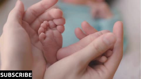 Baby feet in mother hands