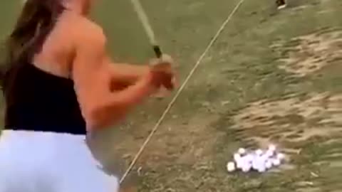 Baby Screams As Mum Misses Golf Ball.