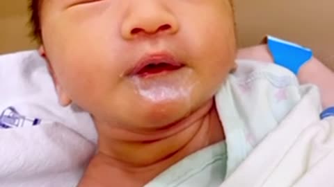 Korean baby nodding while eating milk