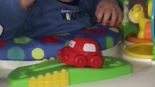 Bouncing Baby Boy Loves His Toys