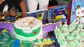 Boy Buries Head into Birthday Cake