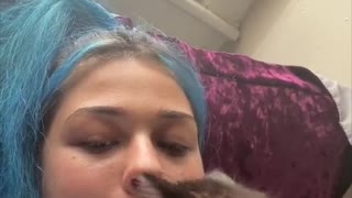 Kitty Tries to Climb into Owners Mouth