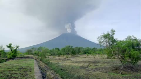 man visits area where there are many volcanoes erupting