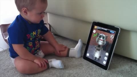 See baby playing with phone
