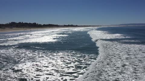 Pismo Beach surfs up on the south side of the pier.