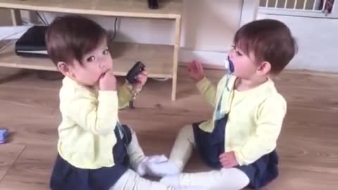 Two cute twin babys fight cars kys and play.....