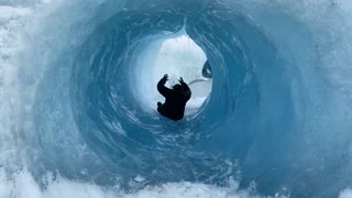 Sliding Through Glacial Ice Cave