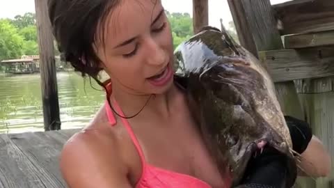 Woman catches fish in totally awesome way