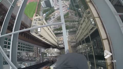 Daredevil Performs Dangerous Stunts On Top Of A High Building