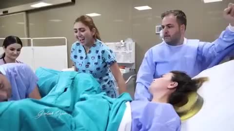 look at the father's face when he sees the baby being born