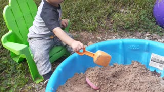 Playing Outside in Sandbox