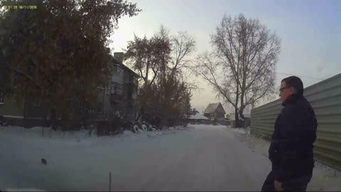 Man Rescues Kitten From Snowy Street