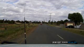 Stolen Car Peels Out, Nearly Hitting Passing Car