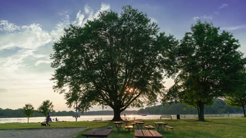 A Gorgeous Time Lapse Video of a Park on the Water at Sunset.