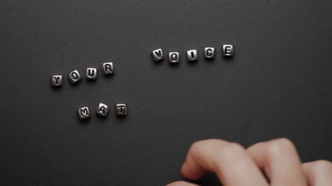 A Person Putting Cube Letters