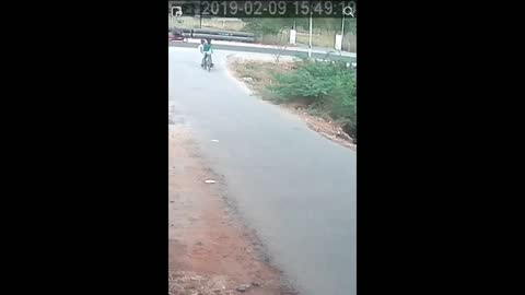 Horrific moment a snake gets entangled in the wheel of cyclist as he runs for life