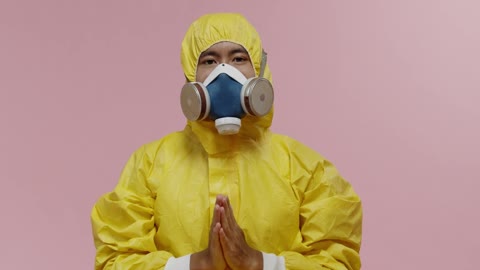 Man in lab suit doing yoga