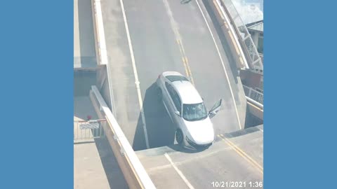 Drawbridge opens while driver still inside car