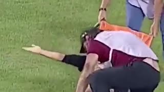 soccer player gets hurt and the medical team is ashamed