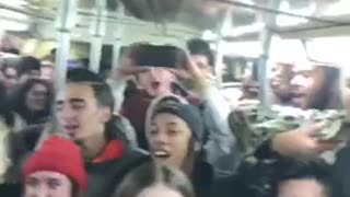 Pt. 2 party on subway train, guy says yeah through microphone