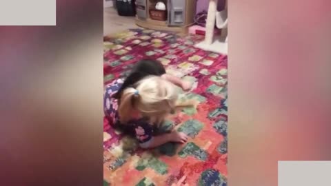 Cat play with a little baby