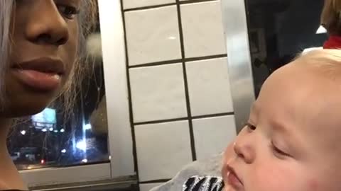 funny Baby Stares At Woman Then Smirks