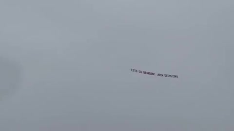 "Let's go Brandon!" flying banner seen in the sky. Glorious!